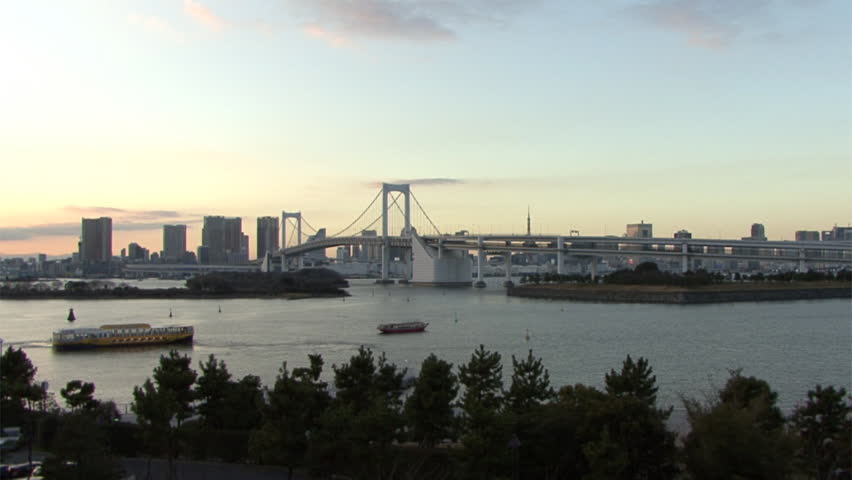 Pan over the Odaiba bay, showing the famous Rainbow bridge.