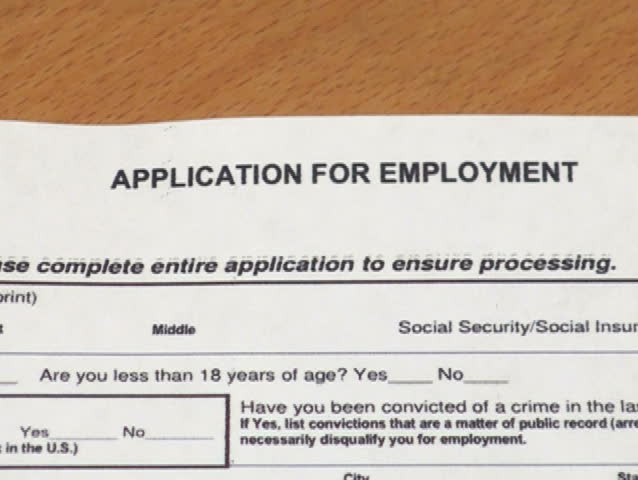 Job application form viewed through magnifying glass V2 - NTSC