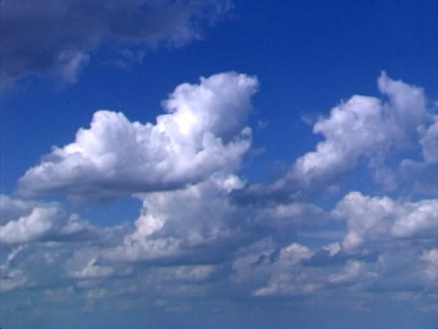 Clouds passing over a blue sky.