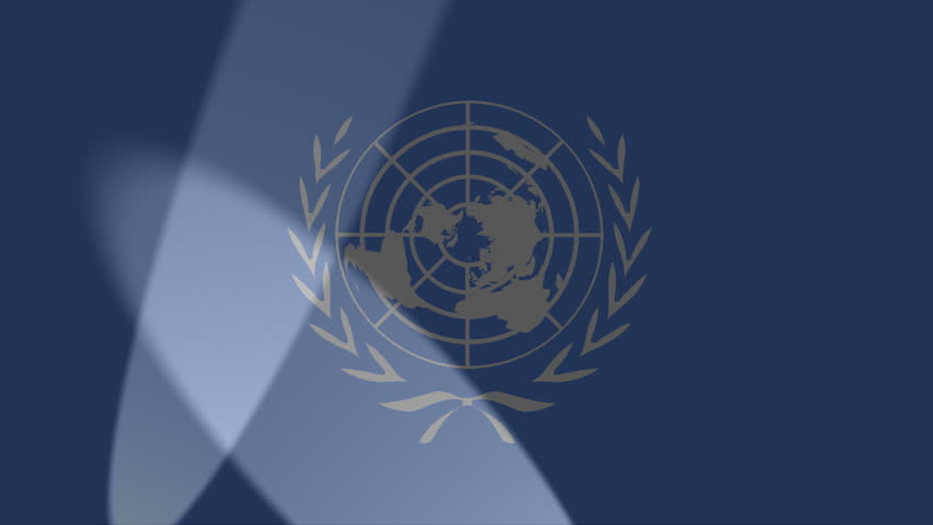 spotlights move across flag of United Nations
