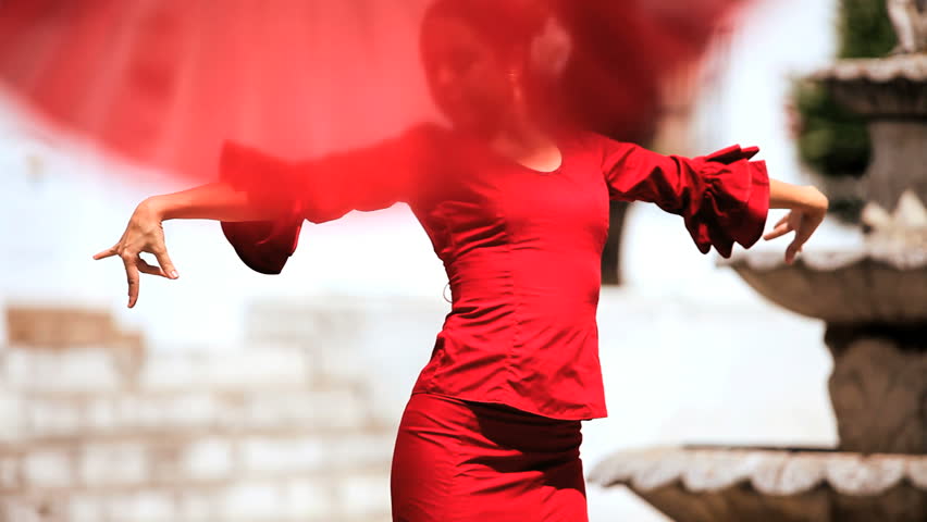 Two ladies dancing traditional flamenco in town square in Seville, Spain 