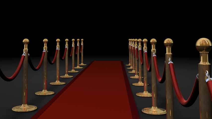 1080p HD Video of camera panning forward with camera flashes on red carpet and dividers.