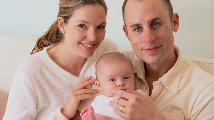 Portrait of mother, father and baby