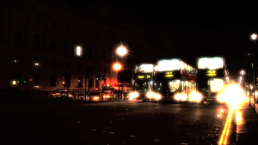 London transport double Decker buses on the streets at night