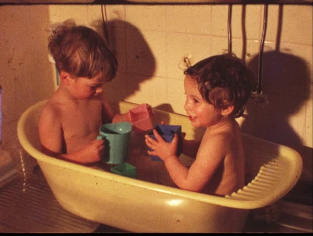 Boy and girl in washing tub (vintage 8 mm amateur film)