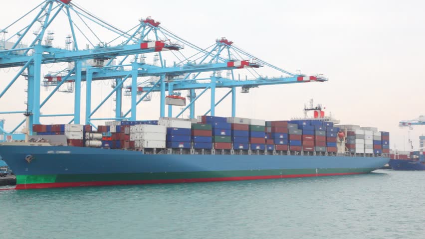cargo-ship with containers in seaport during shipment
