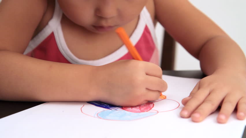 Portrait of a little girl drawing a sketch
