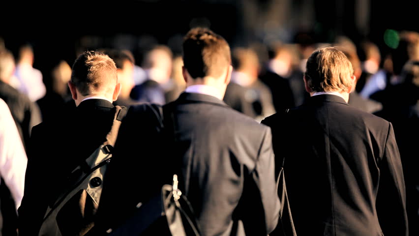 City streets crowded with morning commuters walking to work