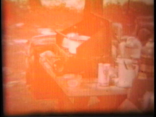 A family goes on a summer camping holiday complete with portable camp stove and supplies.