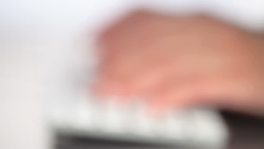 Typing on a Computer Keyboard rack focus