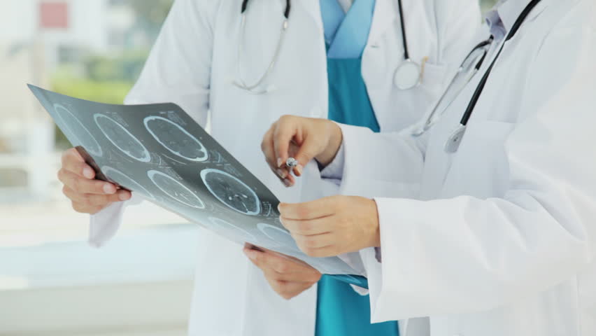 Doctors Looking Over an MRI
