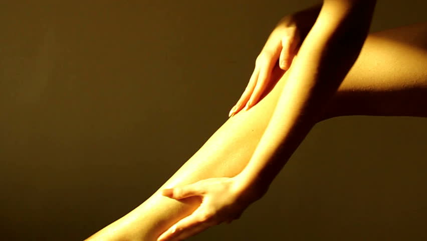 Woman Applying Body Lotion