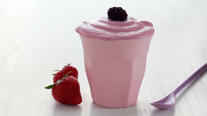 having a spoonful of smoothie 