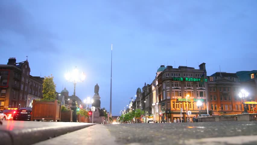 DUBLIN - JUNE 10: People and vehicle traffic at dusk on O'Connell Street, June 10, 2010 in Dublin, Ireland. O'Connell Street is Dublin's main thoroughfare and one of Europe's widest streets. 