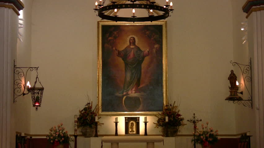 Video zoom out from painting of Jesus Christ to chapel pews inside of old Spanish Mission Concepcion in San Antonio, Texas. Built in early 1700Ã¢â¬â¢s by missionaries from Spain and local Indians.  