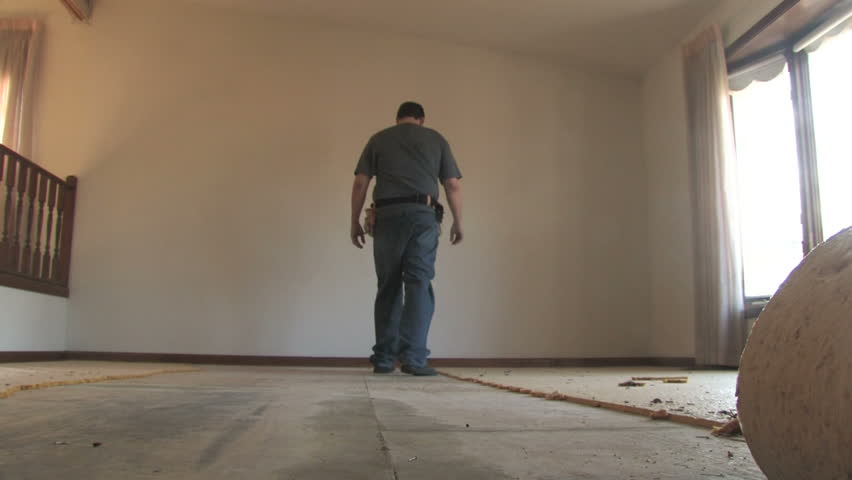 Man Removing Carpet