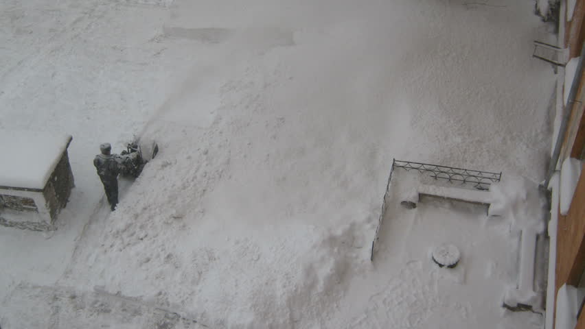 Road cleaning workers after snowfall