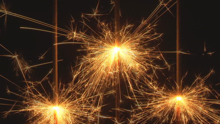 three sparkler close on black