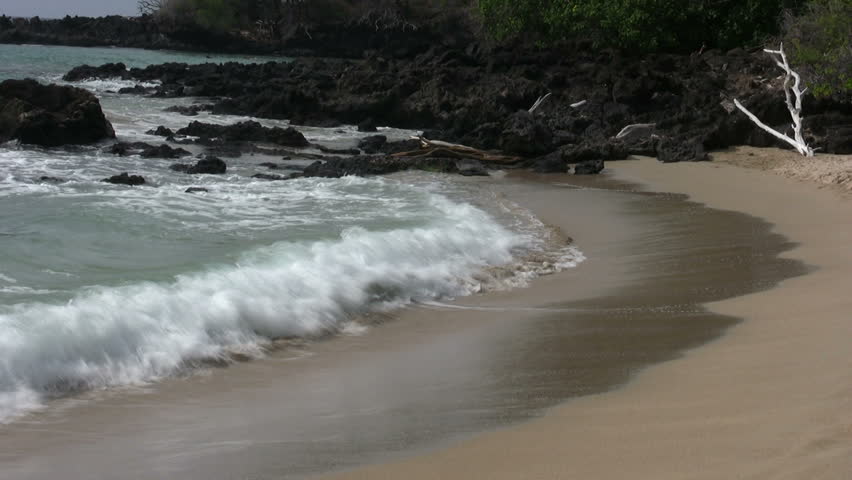 two clips surf and lava rocks and a solitude woman looking out at the ocean