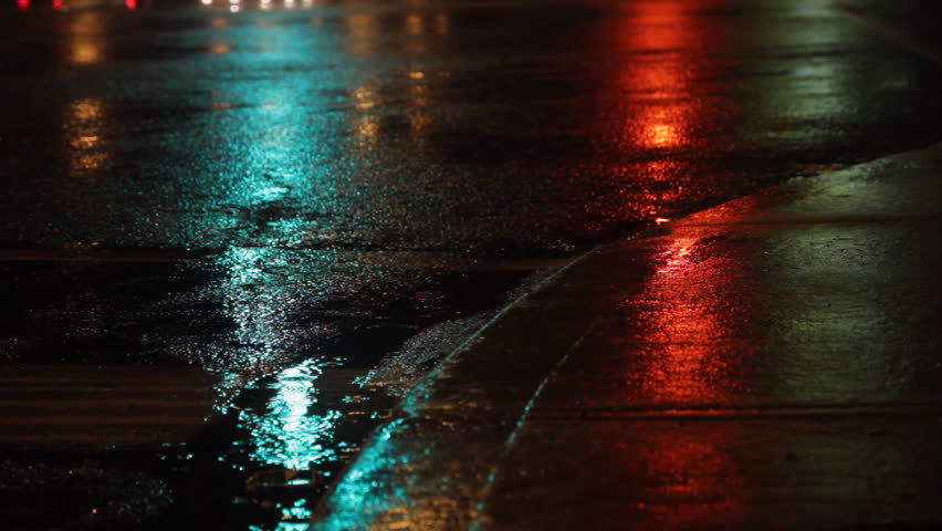 Rainy night. Traffic lights green, amber, red. Rainy night in the city. Reflection of traffic lights changing from green to amber to red. Sound of traffic. Shallow DOF. Toronto, Ontario, Canada. 