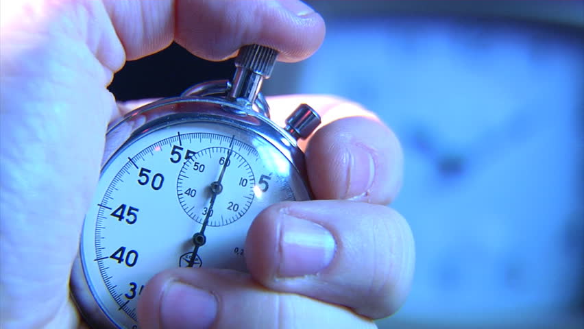 hand push the start button on stop-watch