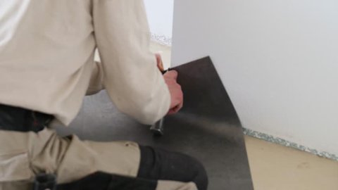Tradesman Laying Down Linoleum Flooring Stock Footage Video 100