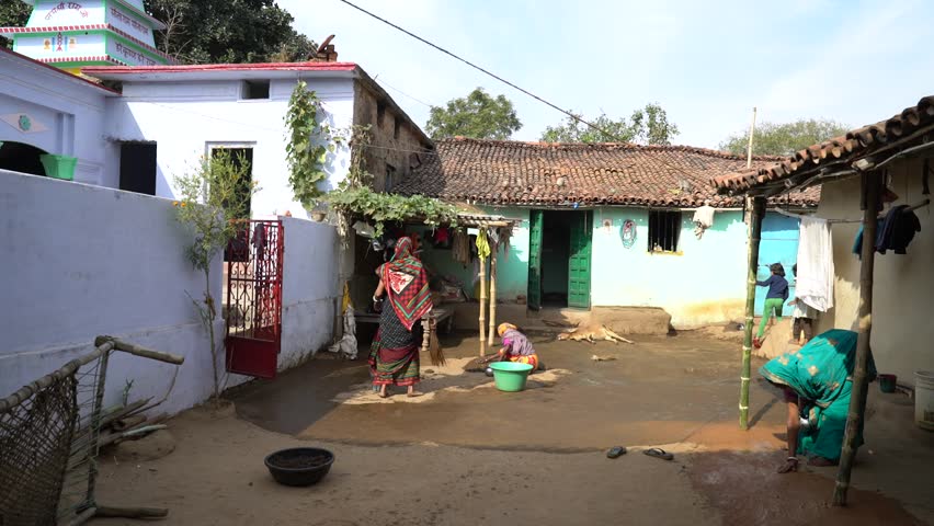 Hd00 12woman Applying Cow Dung On The Floor For Cleanliness