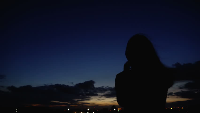 Silhouette%20Woman%20Looking%20Sunset%20Sky%20Back%20Stock%20Footage%20Video%20%28100%%20%20Royalty-free%29%201008773153%20|%20Shutterstock
