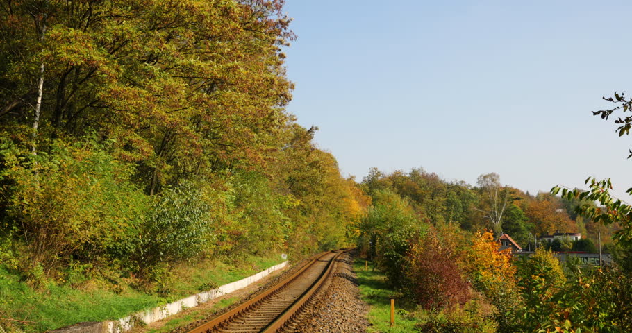 Railroad Tracks between the trees into the Clouds image - Free stock ...