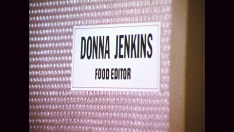 1960s Name Plate On Door Woman Sits At Desk In Office Looks At Papers