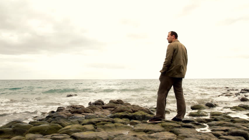 Time Lapse Of Night Clouds And Man Standing, Watching Pacific Ocean ...