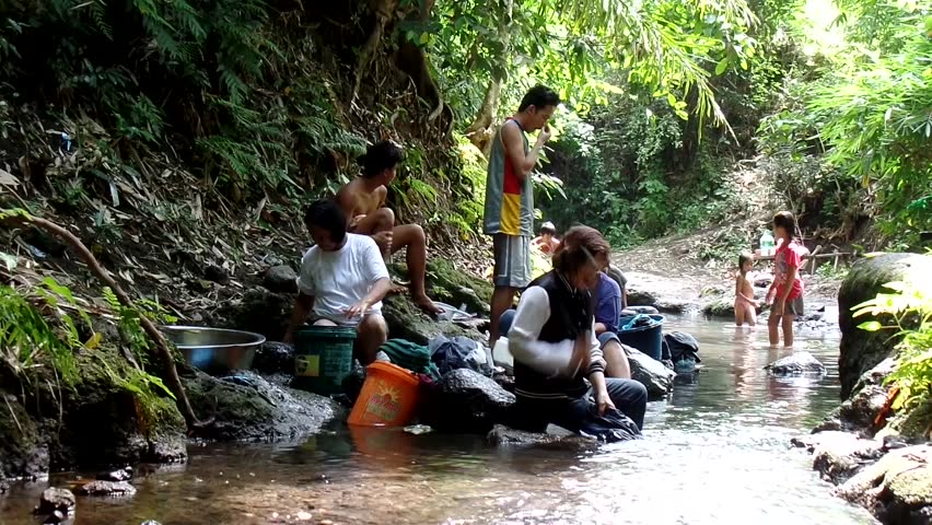 CIRCA 2010s - Belize - Women Wash Clothes In A River In A Third World ...