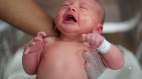 Toddler Shower Porn - Newborn baby taking a bath for first time at the hospital