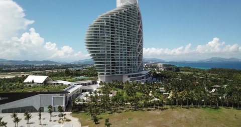 Sanya Hainan China June 7th 2019 Mangrove Tree Resort Landmark Luxurious Hotel Building Shaped Like A Sea Shell Facing The South China Sea Of Pacific Ocean Eyelevel Pedestal Up Aerial Shot - 