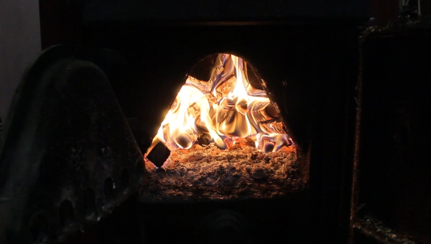 Fire Burns In The Boiler Of A Home Heating System