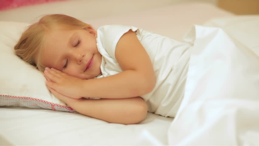 Cute Little Girl Sleeping In Bed Hugging Teddy Bear Waking Up And ...