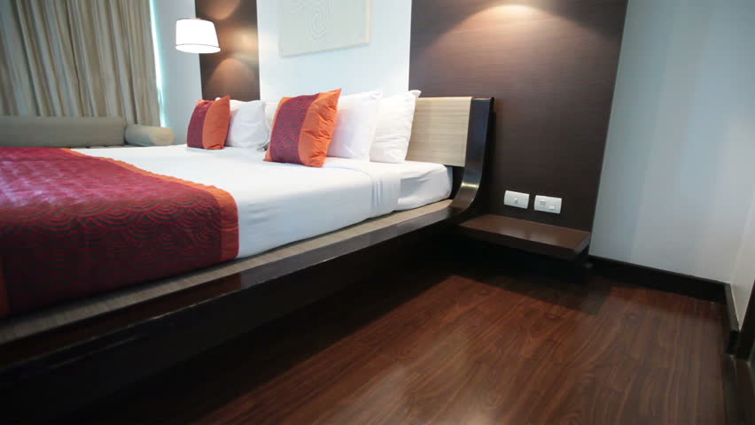 Modern Furniture Video wood floor of a new house with modern furniture. dolly shot. stock Modern Furniture Video wood floor of a new house with modern furniture. dolly shot. stock