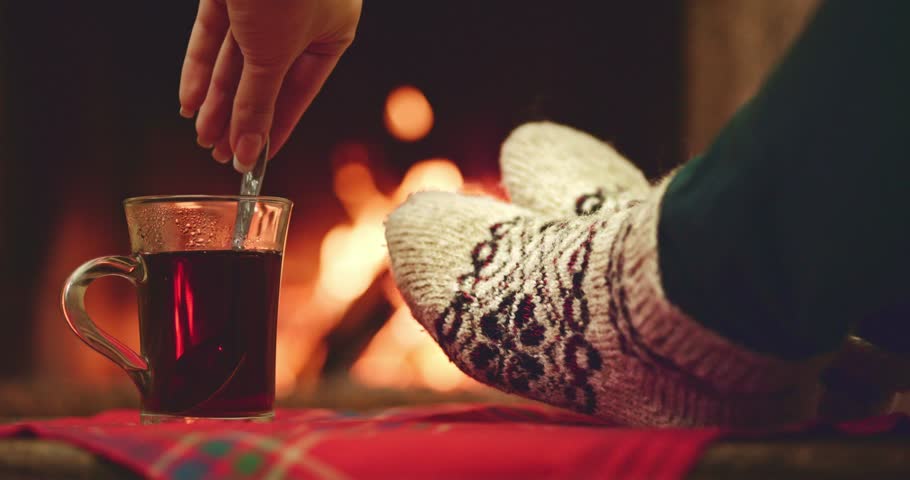 sock fireplace by the fireplace in woollen socks taking a sock fireplace by the fireplace in woollen socks taking a