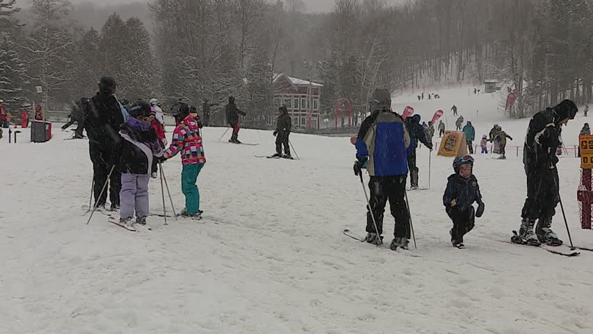 Ontario, Canada December 2013 Diverse People Walking In Blizzard Snow 