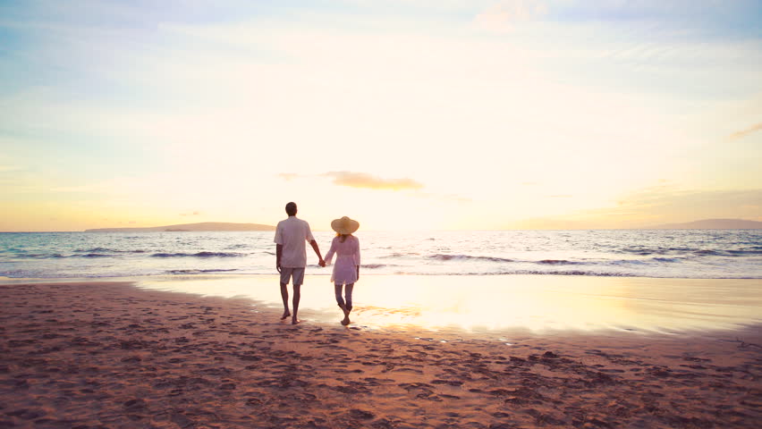 Sunset Walk On The Beach. Older Retirement Couple Holds Hands And Runs ...