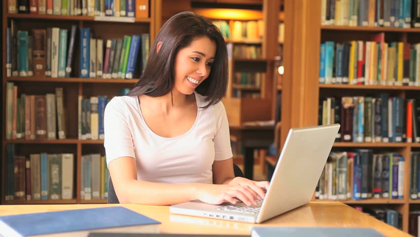 A Female College Student Studies In The Library Stock Footage Video