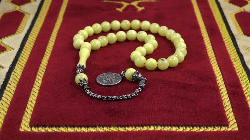 Hd00 25islamic Prayer Beads Made Of Amber Over Prayer Rug Under