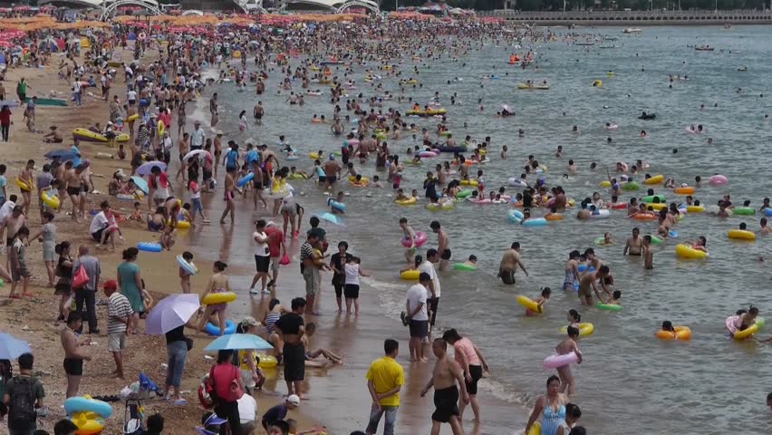 A Lot Of People At Crowded Bathing Sandy Beach.People Swim In Sea,China ...