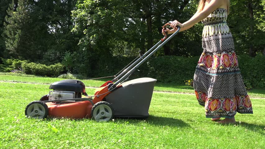 Beautiful Barefoot Woman In Dress And Hat Mowing Lawn Grass In ...