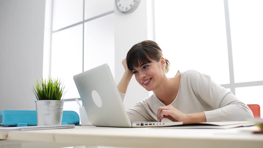 Smiling Woman Sitting at Desk, Video de stock (totalmente libre de ...