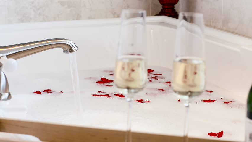 Rose Petals And Champagne Glasses Stock Footage Video 100 Royalty Free 16444663 Shutterstock