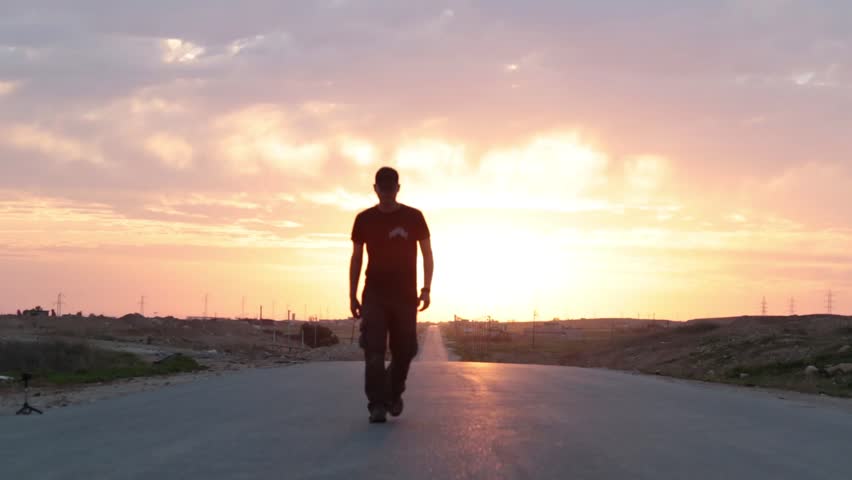 Man Walking Down A Road And Into The Sunset Stock Footage Video ...