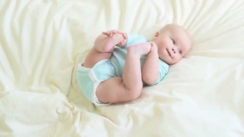 Baby Rolls Over In Bed Stockvideos Filmmaterial 100