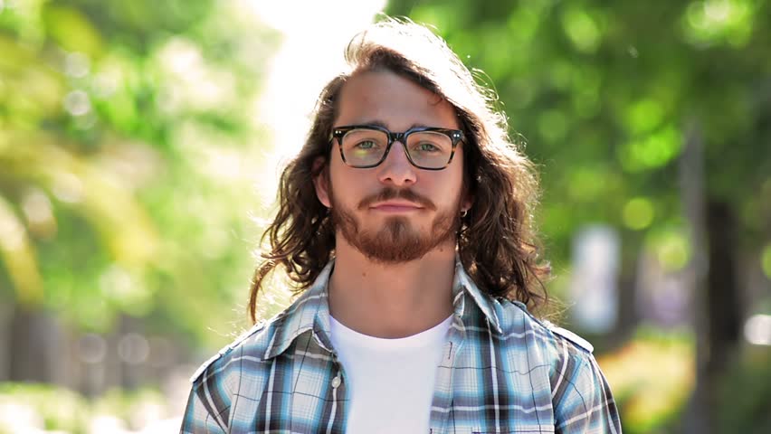 Young Man Portrait In A Park Middle Twenties Long Hair Blue Eyes