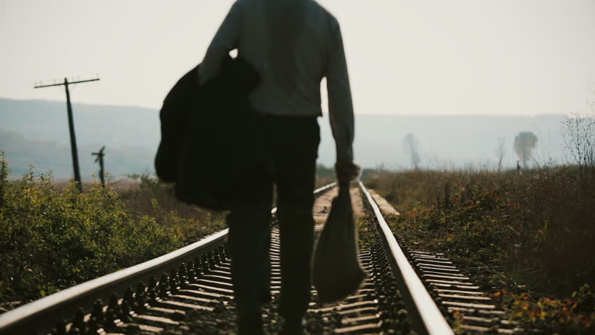 Man Facing Away On Railroad Tracks Hoodoo Wallpaper